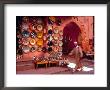 Muslim Man Walks By Wall Of Moroccan Pottery, Marrakech, Morocco by John & Lisa Merrill Limited Edition Print
