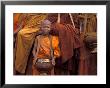 Monk With Alms Wok At That Luang Festival, Laos by Keren Su Limited Edition Print