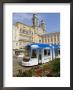 Tram And Old Cathedral, Hauptplatz, Linz, Austria by Charles Bowman Limited Edition Print