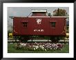 A Bright Red Caboose And A Flower Bed Compete For Vivid Color by Stephen St. John Limited Edition Pricing Art Print
