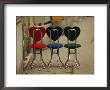 A Trio Of Fashionable Chairs With Heart-Shaped Backs On A Sidewalk by Raul Touzon Limited Edition Pricing Art Print