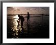Families Play In A Shallow Lagoon At Sunset by Michael Nichols Limited Edition Print