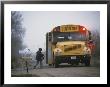 A Student Boards A School Bus In The Morning Fog by Joel Sartore Limited Edition Print