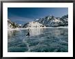 A Girl Ice Skates Across A Frozen Mountain Lake by Michael S. Quinton Limited Edition Print