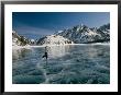 A Girl Ice Skates Across A Frozen Mountain Lake by Michael S. Quinton Limited Edition Pricing Art Print