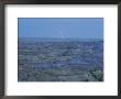 A Bolt Of Lightning Is Seen Behind A Badlands Panorama by Michael Melford Limited Edition Pricing Art Print