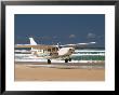 Plane About To Land On Seventy Five Mile Beach, Queensland, Australia by David Wall Limited Edition Print