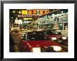 Kowloon Street Scene At Night With Neon Signs, Buses, And Taxis by Eightfish Limited Edition Print