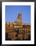 Moon In The Sky Above Cathedral And Houses Clustered Below At Sunset, Siena, Tuscany, Italy, Europe by Ruth Tomlinson Limited Edition Print