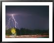 Lightning And Time Exposure Of Taillights On A Rainy Road by Roy Gumpel Limited Edition Print
