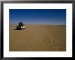 Car Crossing Sahara Desert, Algeria by Peter Ptschelinzew Limited Edition Print