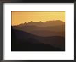 Silhouetted Mountains In Hues Of Gray Under A Twilight Sky by Michael S. Quinton Limited Edition Print