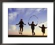 Silhouette Of Children Jumping Rope Outdoors by Mitch Diamond Limited Edition Print