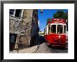 Tram Travelling Through Alfama, Central Lisbon, Lisbon, Portugal by Damien Simonis Limited Edition Pricing Art Print