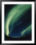 The Aurora Borealis Creates Fantastic Swirls Of Light In The Northern Sky by Paul Nicklen Limited Edition Print
