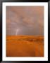 A Bolt Of Lightning Strikes The Sand Dune Landscape by Skip Brown Limited Edition Print