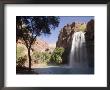A Large Waterfall Hydrates A Narrow Canyon And Fills A Small Pool by Taylor S. Kennedy Limited Edition Print
