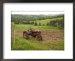 A Tractor Sits In A Farm Field On A Misty Rainy Morning In Springtime, Prince Edward Island, Canada by Taylor S. Kennedy Limited Edition Print