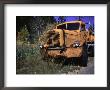 An Orange Truck At A Car Cemetery In Colorado by Michael Brown Limited Edition Pricing Art Print