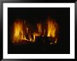 A Log Fire In A Fireplace by Todd Gipstein Limited Edition Print