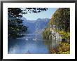 Two Boats Take A Scenic Trip Through A Mountain Valley Of Fall Colors by Norbert Rosing Limited Edition Pricing Art Print