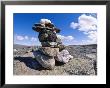The Stacked Stones Of A Cairn Marker In The Arizona Landscape by Paul Nicklen Limited Edition Print