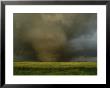 An F4 Category Tornado Travels Across A Field At Great Speed by Peter Carsten Limited Edition Pricing Art Print