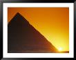 Sun Sets Behind Khufus Great Pyramid At Giza, Khufu Is Also Known As Cheops by Mark Cosslett Limited Edition Print