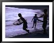 Young Surfers On Black-Sand Beach, French Polynesia by Peter Hendrie Limited Edition Pricing Art Print