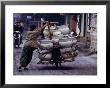 Man Transporting Locally Made Ceramic Pots By Bicycle, Hanoi, Vietnam by Mason Florence Limited Edition Print