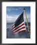 An American Flag Flutters From The Back Of A Boat In Neah Bay by Sam Abell Limited Edition Print