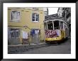 Cable Car In Narrow Streets, Lisbon, Portugal by Michele Molinari Limited Edition Print