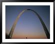 A Lone Person Passes Beneath The Gateway Arch In Saint Louis by Joel Sartore Limited Edition Print