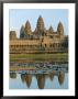 The Stone Causeway Leading To The Angkor Wat Temple In Evening Light, At Siem Reap, Cambodia, Asia by Gavin Hellier Limited Edition Print