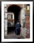 Woman Walking Into Covered Alley, Radda In Chianti, Tuscany, Italy by John & Lisa Merrill Limited Edition Print