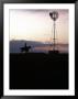 Silhouette Of Cowboy And Horse Near Windmill by Tim O'hara Limited Edition Print