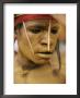 Bright Yellow Face Paint And Elaborate Headdress Decorate The Face Of A Tribesman by Jodi Cobb Limited Edition Print