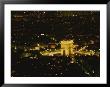 An Elevated View Of The Arc De Triomphe Illuminated At Night by Sam Kittner Limited Edition Print