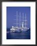 Windstar Cruise Ship In Mykonos Harbor, Greece by Walter Bibikow Limited Edition Print