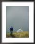 A Woman Rides Her Bicycle Towards A Tent In The Background by Dugald Bremner Limited Edition Print