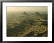 Aerial View Of The Pyramids Of Giza And Excavation Site by Kenneth Garrett Limited Edition Print