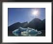 Sunburst And Blue Iceberg With Mountains On The Skyline, Alaska by Ralph Lee Hopkins Limited Edition Pricing Art Print