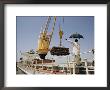 Unloading Freight From A Ship Docked In Khulna by Dick Durrance Limited Edition Print