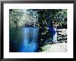 Little Boy Fishing Off Rocks by Ewing Galloway Limited Edition Print