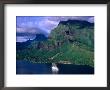 A Sailboat Cruises Past Mountainous Shoreline, Moorea, Society Islands, The, French Polynesia by Peter Hendrie Limited Edition Print