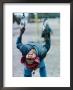 Aymara Boy Playing In Playground, Chucuito, Puno, Peru by Eric Wheater Limited Edition Print