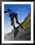 Woman Roller-Blading Along Mountain Road, Canada by Philip Smith Limited Edition Print