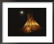 A Tepee Is Illuminated Against The Night Sky by Michael Melford Limited Edition Print