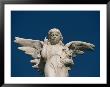 A Statue Of An Angel Pointing Skyward by Raul Touzon Limited Edition Print