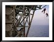 Remote Access Technicians Dangle Off Ropes On An Oil Rig by Eightfish Limited Edition Print